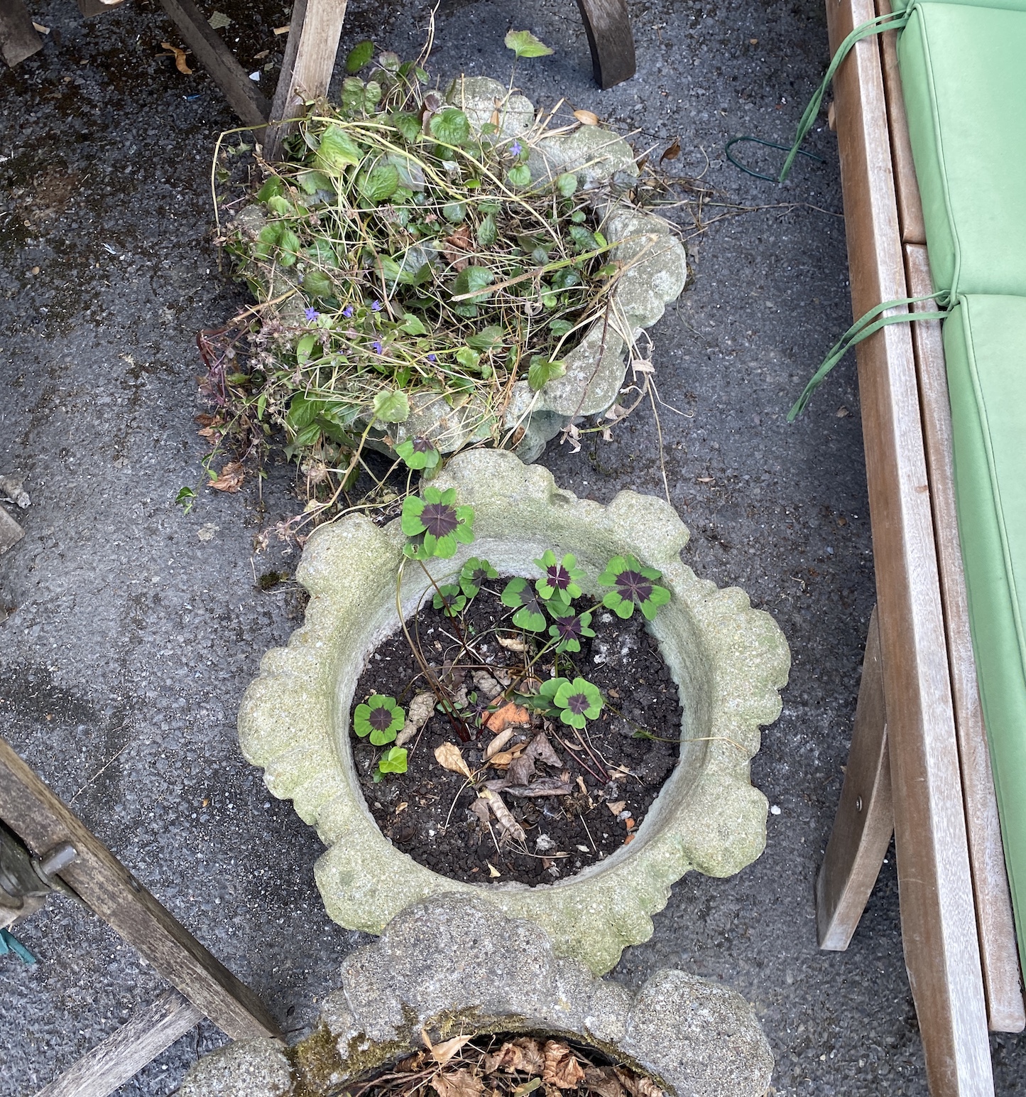A set of three reconstituted stone garden planters (lacking two bases), diameter 46cm.